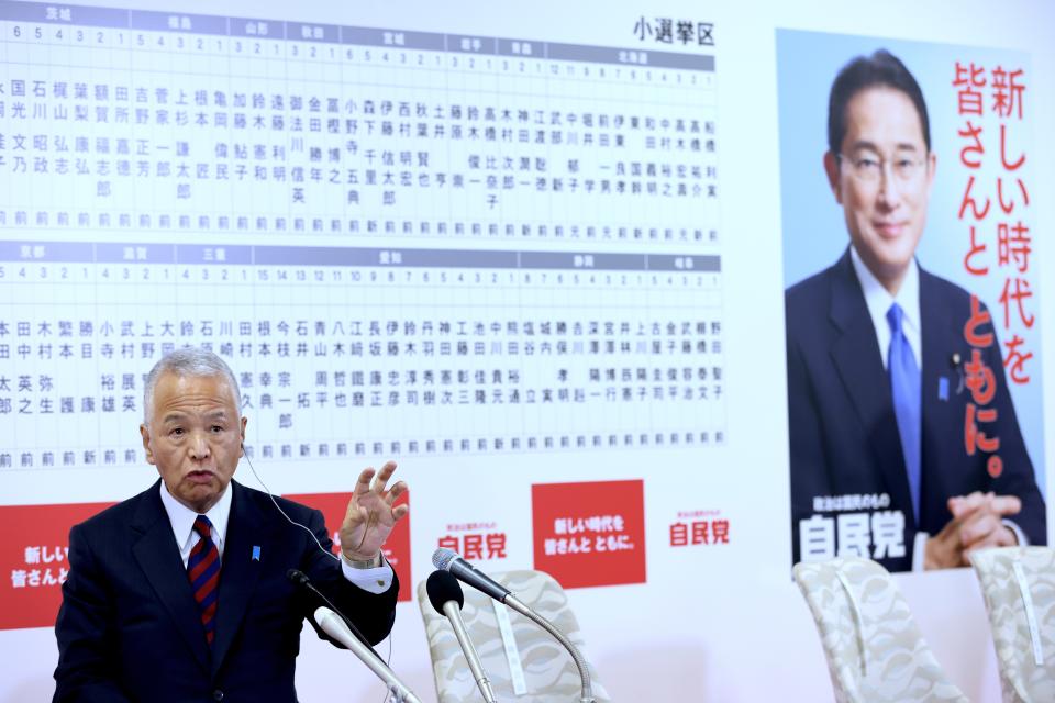 Japan's ruling Liberal Democratic Party (LDP) General Secretary Akira Amari speaks at the party headquarters in Tokyo, Sunday, Oct. 31, 2021. Japanese Prime Minister Fumio Kishida’s governing coalition is expected to keep a majority in a parliamentary election Sunday but will lose some seats in a setback for his weeks-old government grappling with a coronavirus-battered economy and regional security challenges, according to exit polls. (Behrouz Mehri, Pool via AP)