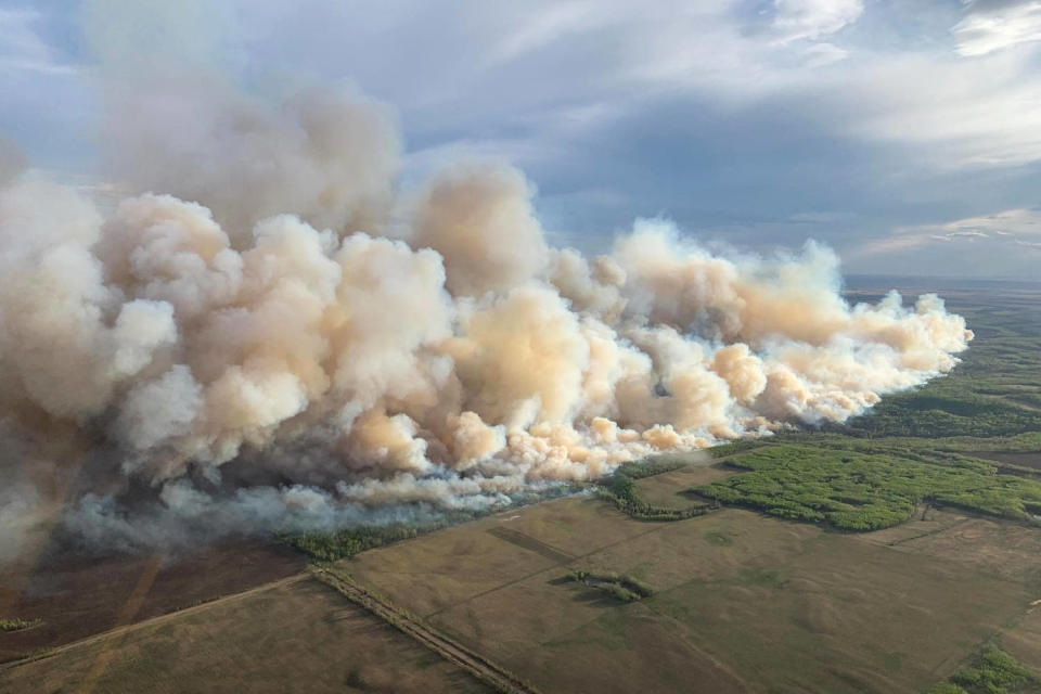 An aerial of smoke billowing  (Alberta Wildfire Service / AFP - Getty Images)