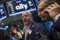 Citi Traders Thomas Ferrigno (L ) and Christopher Fuchs await the IPO of Ally Financial on the floor of the New York Stock Exchange April 10, 2014. EUTERS/Brendan McDermid