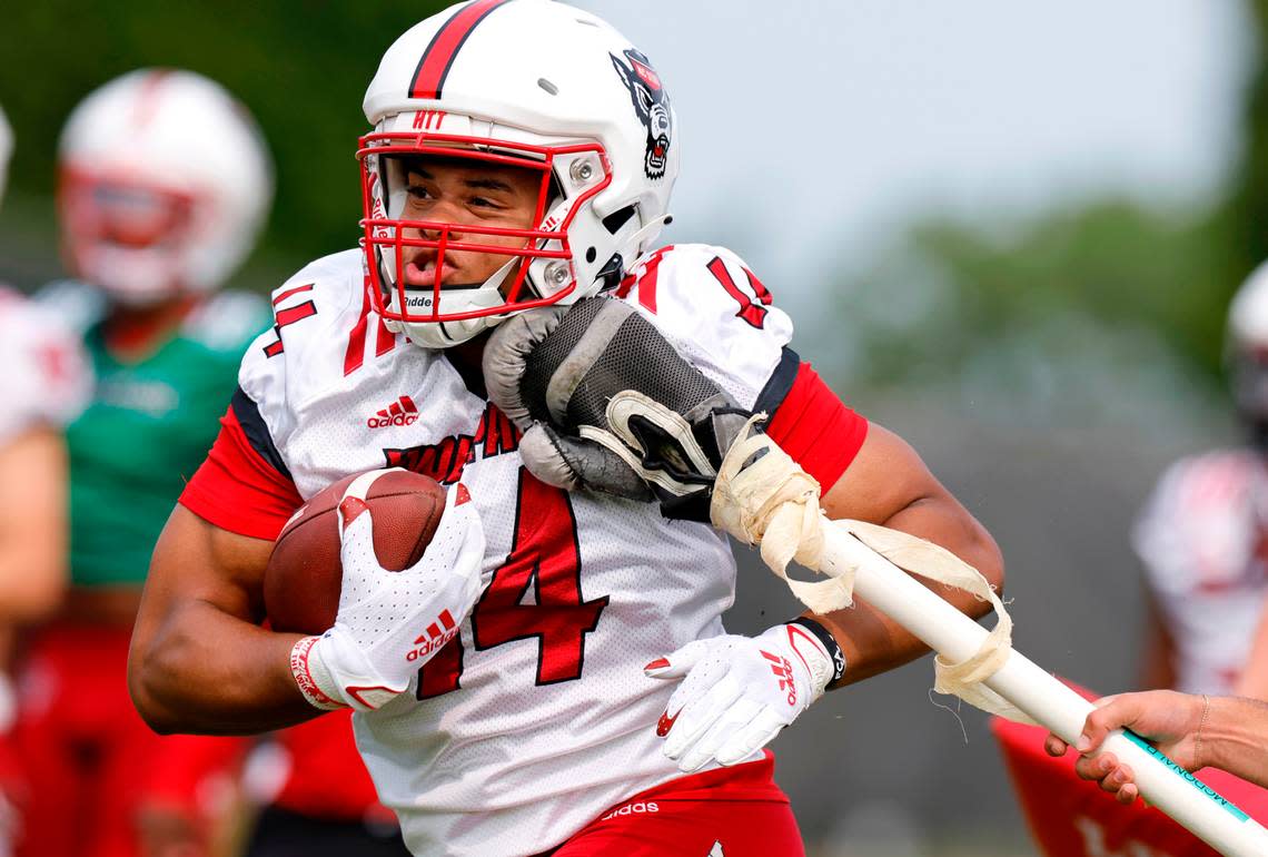 N.C. State tight end Cedd Seabrough (14) runs drills during the Wolfpack’s first fall practice in Raleigh, N.C., Wednesday, August 2, 2023. Ethan Hyman/ehyman@newsobserver.com