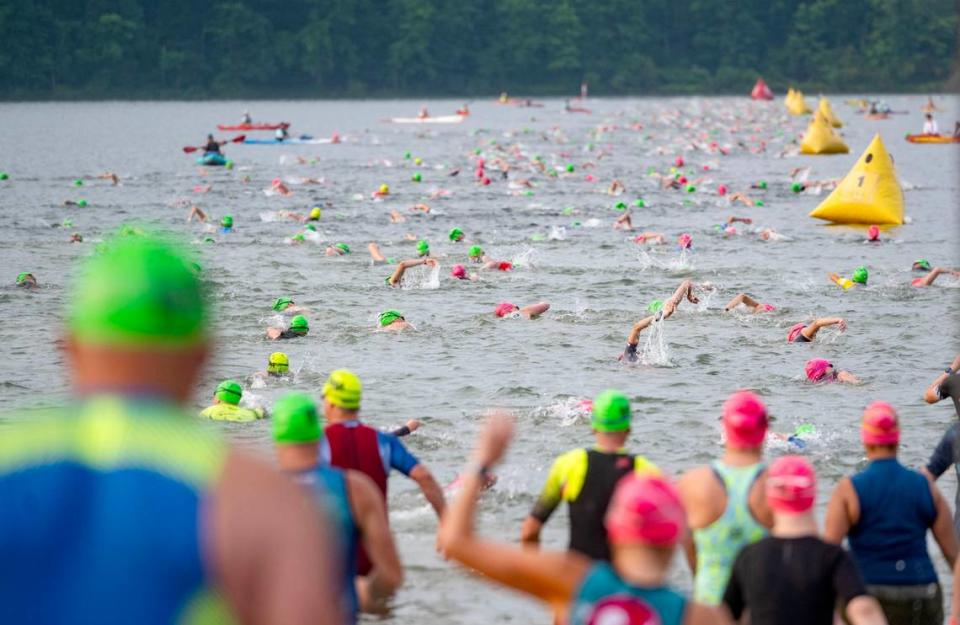 Athletes set off on the 1.2 mile swim in Foster Joseph Sayers Lake at Bald Eagle State Park for the Ironman 70.3 Pennsylvania Happy Valley on Sunday, June 30, 2024.