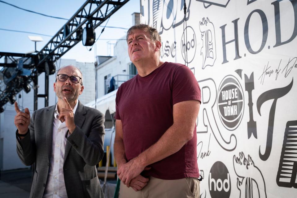 Michael DiLaura, 48, House of Dank chief corporate officer, left, talks with Jon Witz, 61, producer of the Soaring Eagle Arts Beats & Eats festival, at the festival's first designated cannabis space in Royal Oak on Thursday, Aug. 31, 2023.