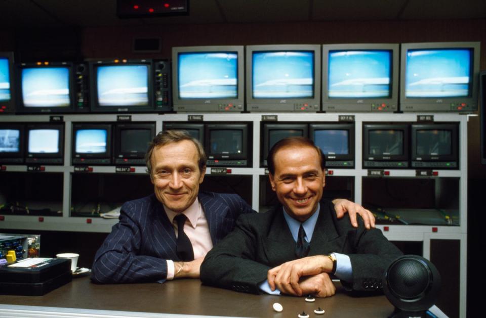 Berlusconi, pictured with French television executive Jerome Seydoux, was a media mogul (Sygma/Getty)