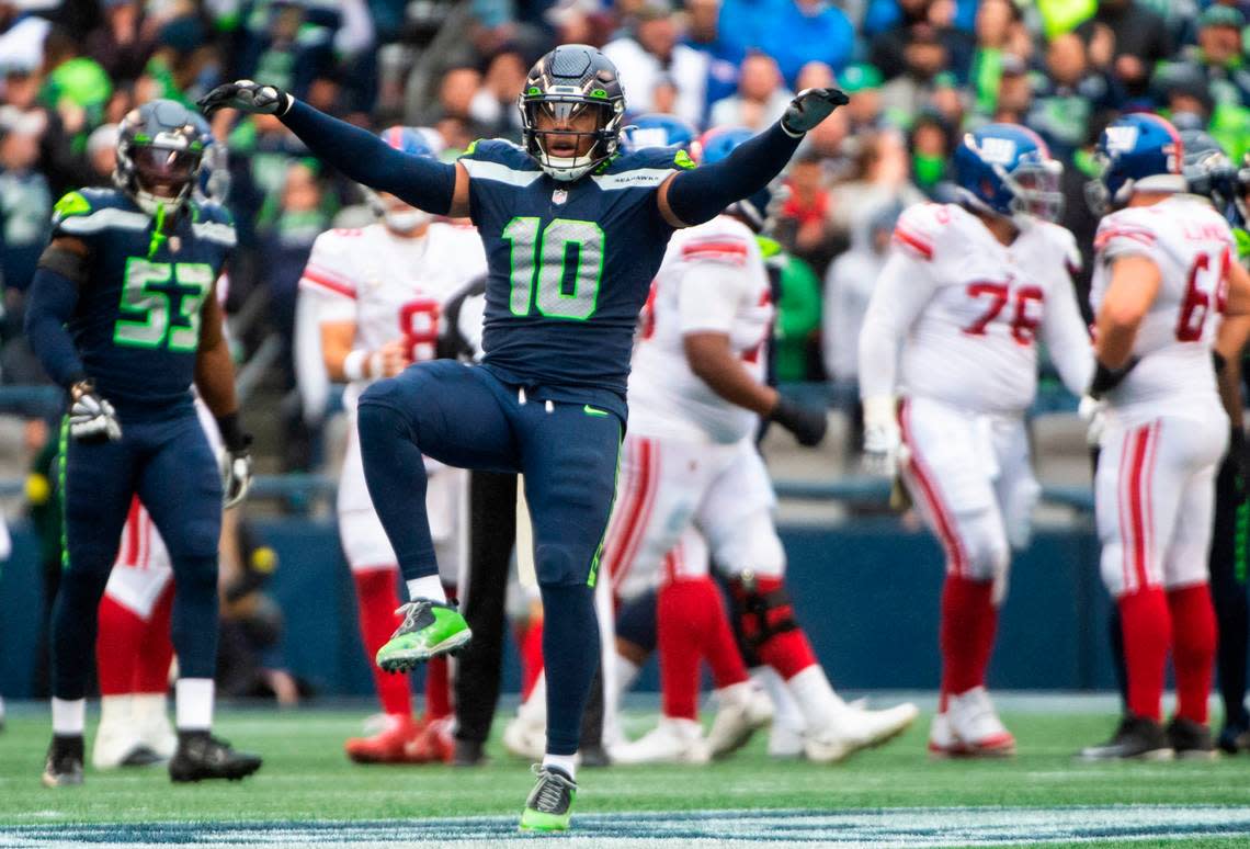 Seattle Seahawks linebacker Uchenna Nwosu (10) imitates a hawk while celebrating after a tackle was made against the New York Giants offense in the fourth quarter of an NFL game at Lumen Field in Seattle, Wash. on Oct. 30, 2022. The Seahawks defeated the Giants 27-13.