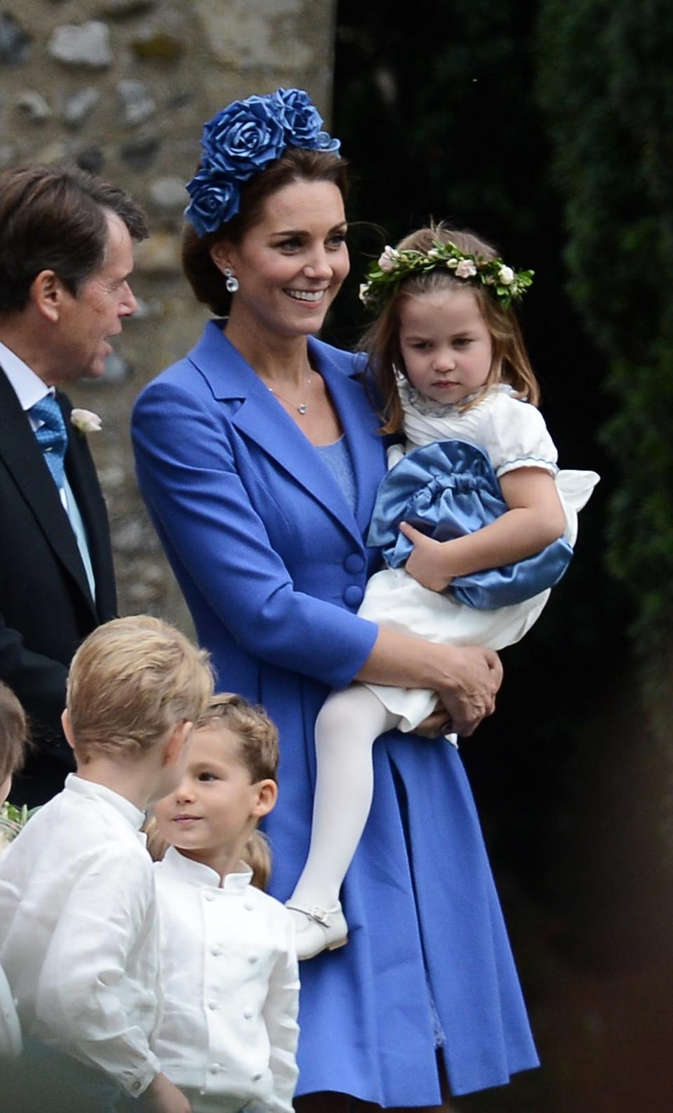 Kate Middleton recycled a rich blue dress for the wedding of a family friend, Sophie Carter, over the weekend.