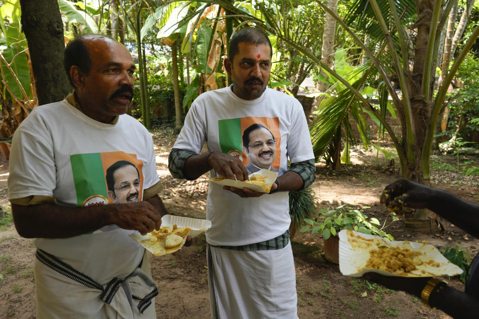 Supporters of M. Abdul Salam, the only Muslim candidate from India's ruling Bharatiya Janata Party, eat breakfast before resuming campaigning in Malappuram, in Indian southern state of Kerala, on April 24, 2024. (AP Photo/Manish Swarup)