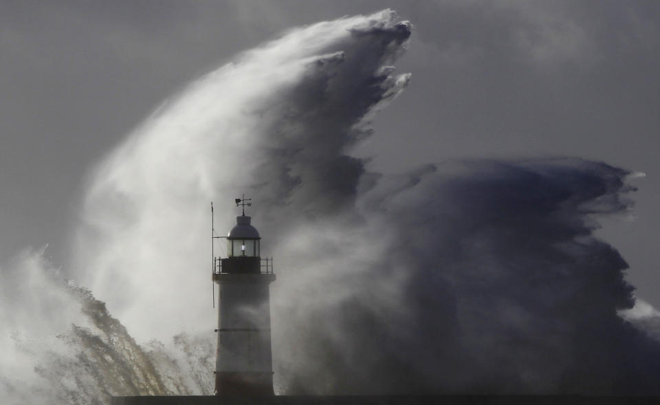 Waves crash against a lighthouse during storms that battered Britain and where a 14-year-old boy was swept away to sea at Newhaven in South East England October 28, 2013. Britain's strongest storm in a decade battered southern regions on Monday, forcing hundreds of flight cancellations, cutting power lines and disrupting the travel plans of millions of commuters. Police said rescuers were forced to call off a search for the boy late on Sunday due to the pounding waves, whipped up by the rising wind. (REUTERS/Luke MacGregor)