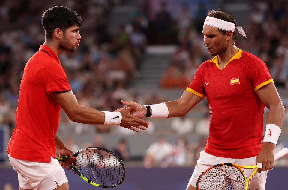 PARIS, FRANCE - JULY 31: Rafael Nadal of Team Spain (R) and Carlos Alcaraz of Team Spain interact against Austin Krajicek of Team United States and Rajeev Ram of Team United States during the Men's Doubles Quarter-final match on day five of the Olympic Games Paris 2024 at Roland Garros on July 31, 2024 in Paris, France. (Photo by Julian Finney/Getty Images)