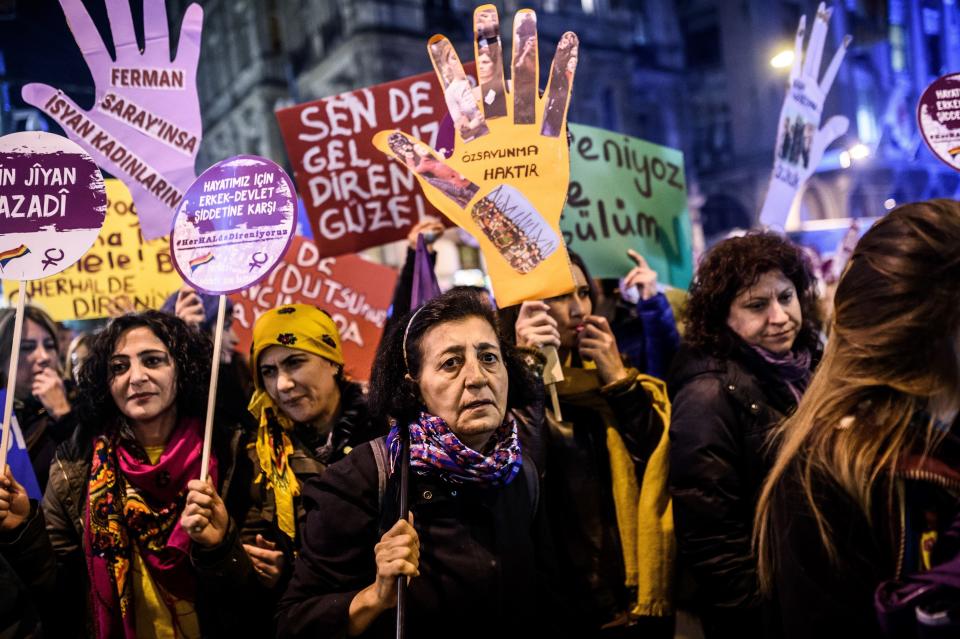 Women shout slogans and hold placards reading 'Women resists against the male dominants' as they take part in a march for women rights on Nov. 25, 2016 at Istiklal avenue in Istanbul.&nbsp;