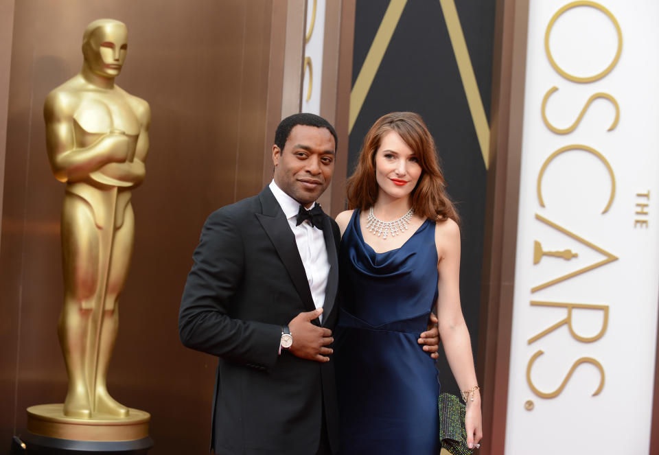 Chiwetel Ejiofor, left, and Sari Mercer arrive at the Oscars on Sunday, March 2, 2014, at the Dolby Theatre in Los Angeles. (Photo by Jordan Strauss/Invision/AP)