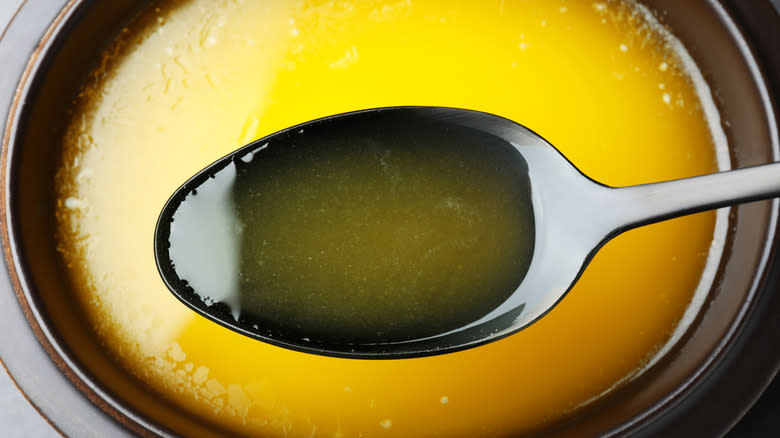 clarified butter on a spoon