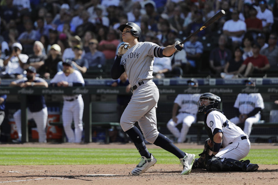 New York Yankees' Aaron Judge watches his two-run home run during the fifth inning of a baseball game against the Seattle Mariners, Wednesday, Aug. 28, 2019, in Seattle. (AP Photo/Ted S. Warren)