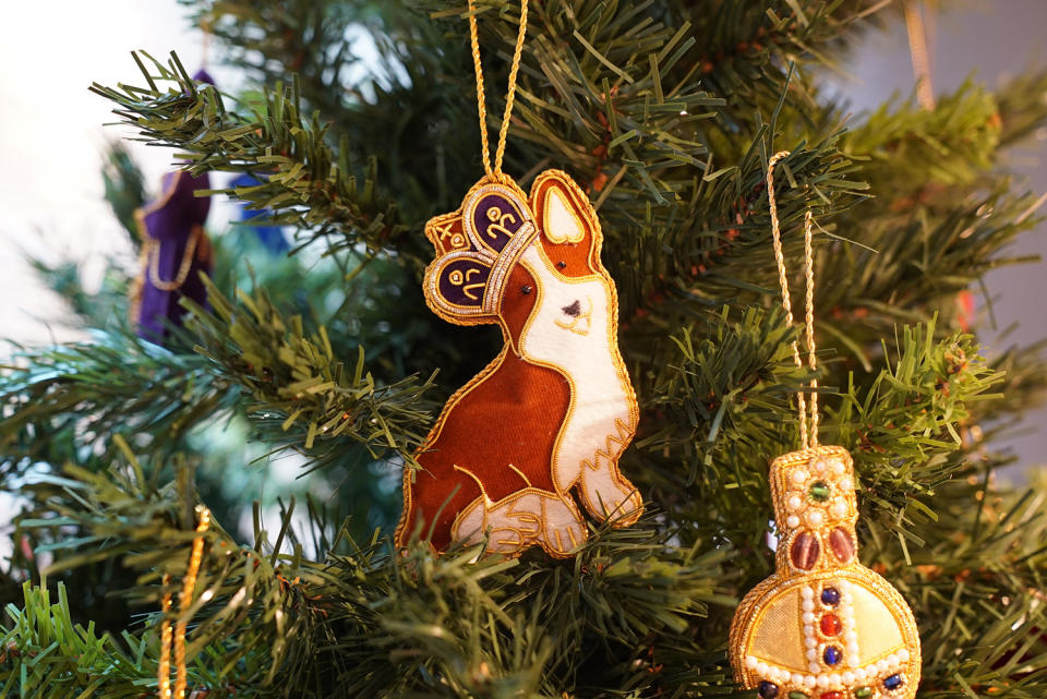 <p>Decorate your Christmas tree with this sweet corgi hanging decoration. Corgis have been the pup of choice for the Queen since she was a teenager and this handmade decoration made from silk threads on a satin background will bring the royal touch to any tree.</p> <p><strong>Buy it! Historic Royal Palaces, Corgi with crown tree decoration, $14.60; <a href="https://www.historicroyalpalaces.com/corgi-with-crown-tree-decoration-1.html" rel="sponsored noopener" target="_blank" data-ylk="slk:historicroyalpalaces.com;elm:context_link;itc:0;sec:content-canvas" class="link ">historicroyalpalaces.com</a></strong></p>