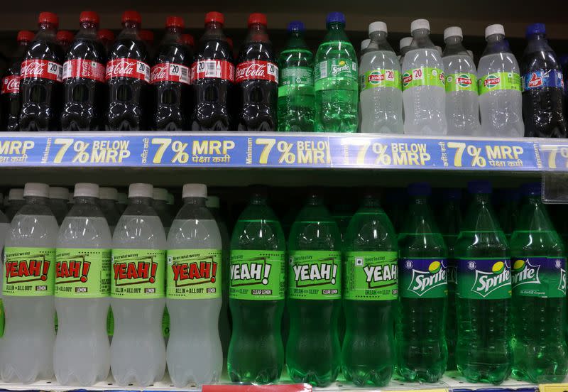 Reliance's Yeah! and Coca-Cola Co. soft drinks are seen on a shelf inside a Reliance supermarket in Mumba