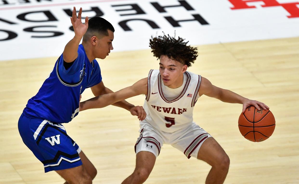 Newark's Jaypar Allen, right, shields the ball from Westhill's Shawn Mayes during a NYSPHSAA Class B Boys Basketball Championship semifinal in Glens Falls, N.Y., Saturday, March 18, 2023. Newark’s season ended with a 63-36 loss to Westhill-III.