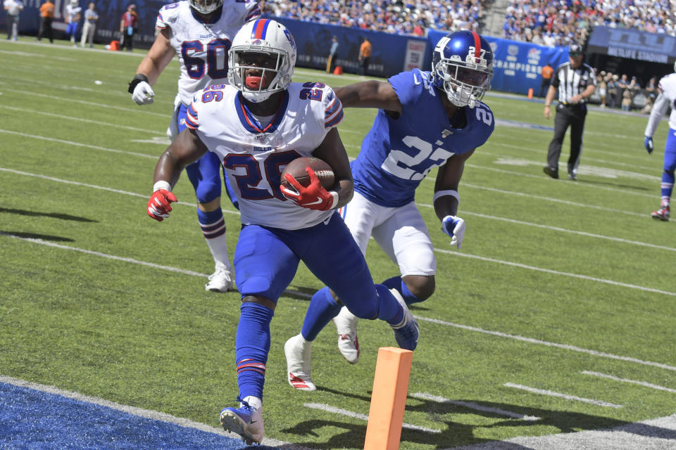 Buffalo Bills running back Devin Singletary (26), left, scores a touchdown during the first half of an NFL football game against the New York Giants, Sunday, Sept. 15, 2019, in East Rutherford, N.J. (AP Photo/Bill Kostroun)