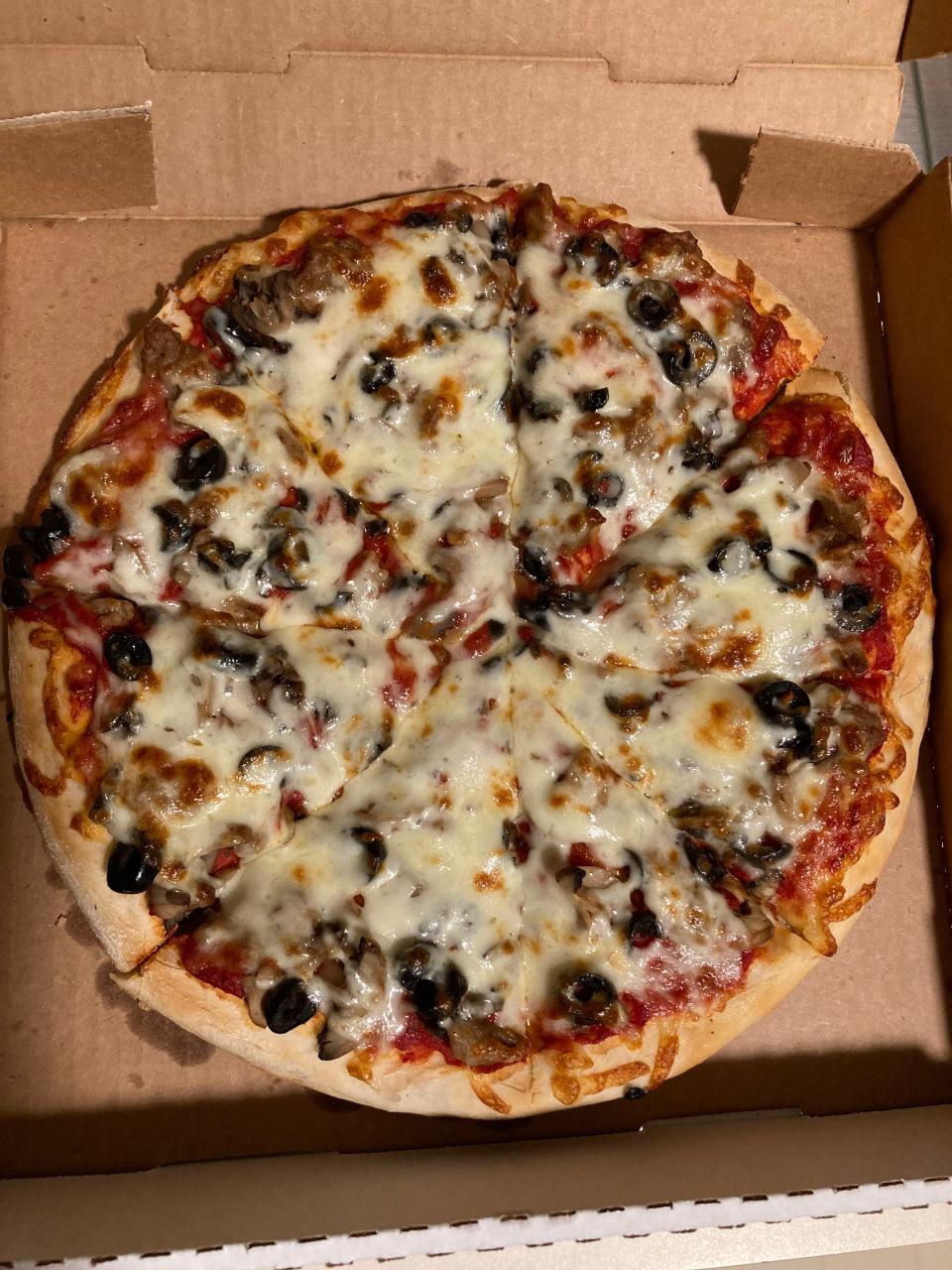 Altieri’s Pizza in Stow serves a 12-inch pizza topped with mushrooms, sausage and black olives.