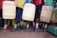 FILE - Samburu women fetch water in Loolkuniyani Primary School, Samburu county, Kenya on Oct. 16, 2022. An international team of climate scientists says the ongoing drought in Eastern Africa has been made worse by human-induced climate change according to a report from World Weather Attribution. (AP Photo/Brian Inganga, File)