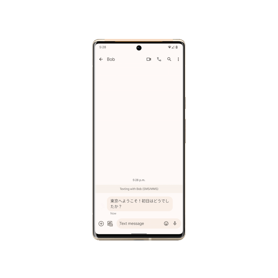 Live Translate on the Pixel 6 messages app. An animation showing a message being typed out in English in the Messages app and simultaneously translated to Japanese.