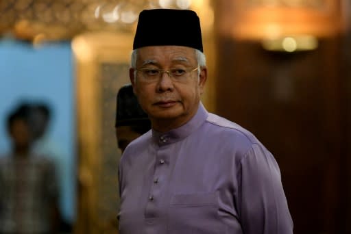 Malaysia's former prime minister Najib Razak is barred from leaving Malaysia and police have seized large amounts of cash, jewels and luxury items from his home and other sites