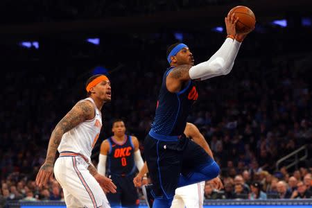 Dec 16, 2017; New York, NY, USA; Oklahoma City Thunder power forward Carmelo Anthony (7) shoots against New York Knicks small forward Michael Beasley (8) during the first quarter at Madison Square Garden. Mandatory Credit: Brad Penner-USA TODAY Sports