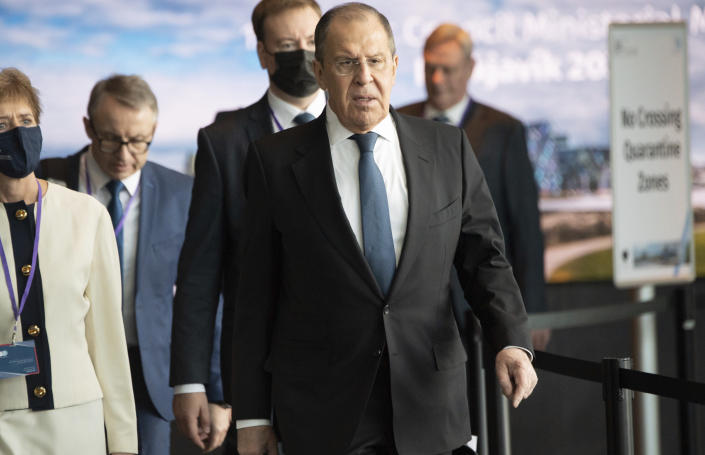 Russian Foreign Minister Sergey Lavrov centre, arrives for the Arctic Council Ministerial Meeting in Reykjavik, Iceland, Thursday, May 20, 2021. Top diplomats from the United States and Russia sparred politely in Iceland during their first face-to-face encounter, which came as ties between the nations have deteriorated sharply in recent months. (Saul Loeb/Pool Photo via AP)