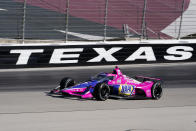 Alexander Rossi rounds the fourth turn during the first practice round of the IndyCar Series auto race at Texas Motor Speedway in Fort Worth, Texas on Saturday, March 19, 2022. (AP Photo/Larry Papke)