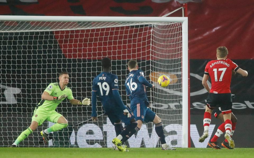 Stuart Armstrong of Southampton scores their team's first gaol past Bernd Leno of Arsenal during the Premier League match between Southampton and Arsenal at St Mary's Stadium - Frank Augstein/Pool-Getty Images