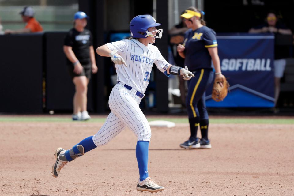 Kentucky catcher Grace Lorsung (33) celebrates after hitting a home run in the fourth inning of a softball game against Michigan in the first round of the Stillwater Regional of the NCAA Tournament in Stillwater, Okla., Friday, May 17, 2024.