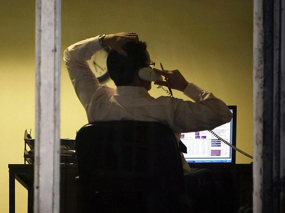 man working late on phone