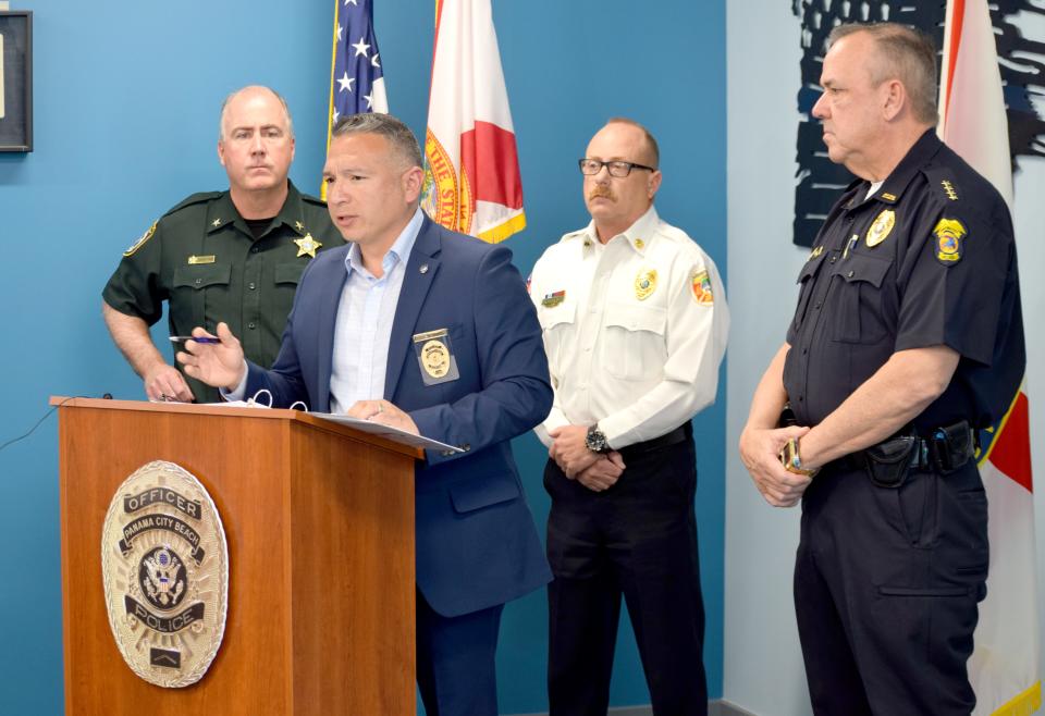 Chief JR Talamantez of the Panama City Beach Police Department speaks at a press conference on Thursday about spring break. Behind him is Bay County Sheriff Tommy Ford (left), Chief Ray Morgan of Panama City Beach Fire Rescue, and Chief Mark Smith of the Panama City Police Department.