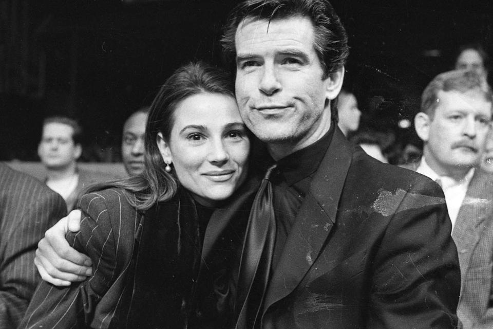 <p>Independent News And Media/Getty</p> Pierce Brosnan and Keely Shaye Smith in 1995