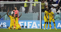 Ecuador's players celebrate their 2-0 win after the World Cup group A soccer match between Qatar and Ecuador at the Al Bayt Stadium in Al Khor, Sunday, Nov. 20, 2022. (AP Photo/Natacha Pisarenko)