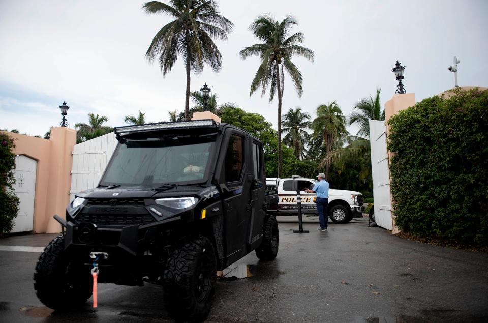 The Southern Boulevard gate to former President Donald Trump's Mar-a-Lago Club is guarded by the Secret Service on Friday.