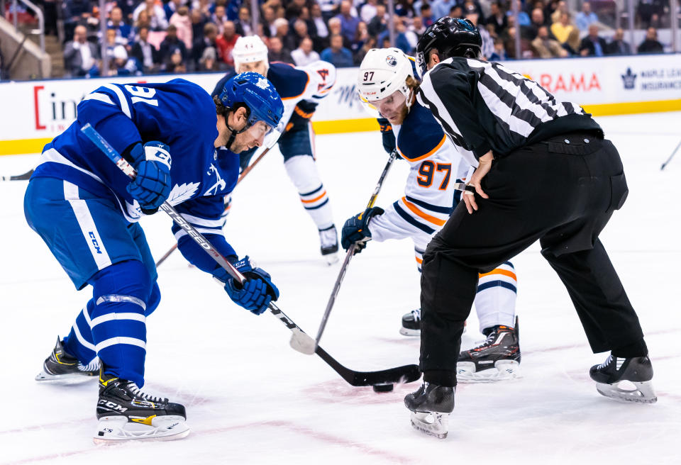 TORONTO, ON - JANUARY 6: John Tavares #91 of the Toronto Maple Leafs takes a face off against Connor McDavid #97 of the Edmonton Oilers during the first period at the Scotiabank Arena on January 6, 2020 in Toronto, Ontario, Canada. (Photo by Kevin Sousa/NHLI via Getty Images)