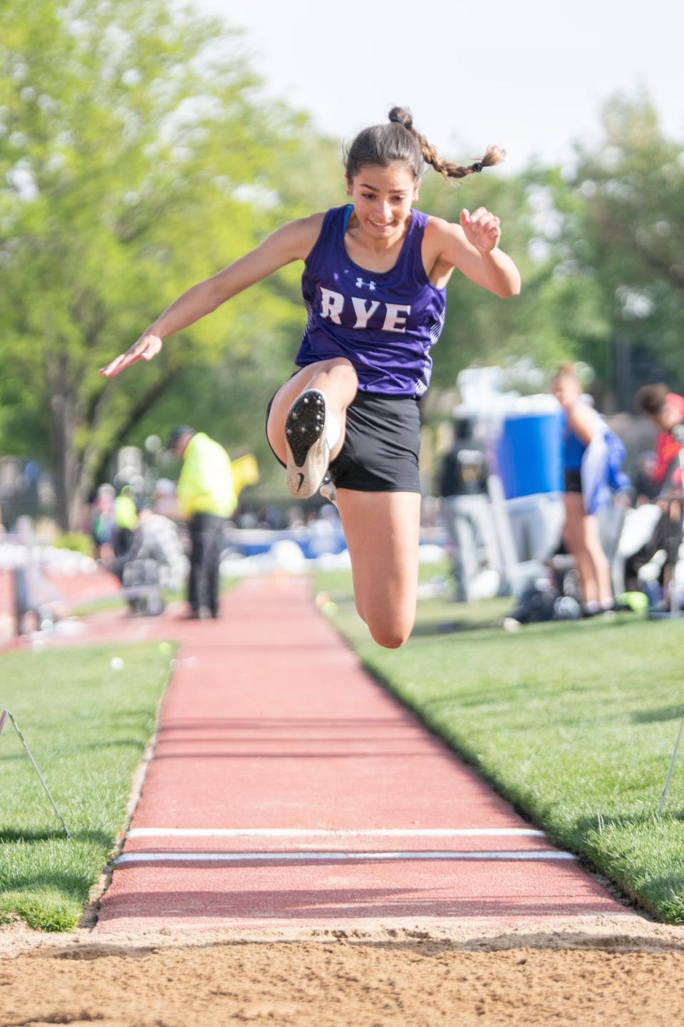 Rye's Hailey George takes flight in the Class 2A long jump final during the CHSSA state track and field meet on Saturday, May 21, 2022 at Jeffco Stadium.