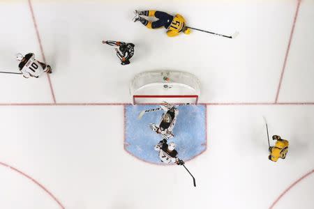 May 22, 2017; Nashville, TN, USA; Nashville Predators left wing Austin Watson (51) reacts on the ice after a hit from Anaheim Ducks right wing Corey Perry (10) in the second period in game six of the Western Conference Final of the 2017 Stanley Cup Playoffs at Bridgestone Arena. Mandatory Credit: Aaron Doster-USA TODAY Sports