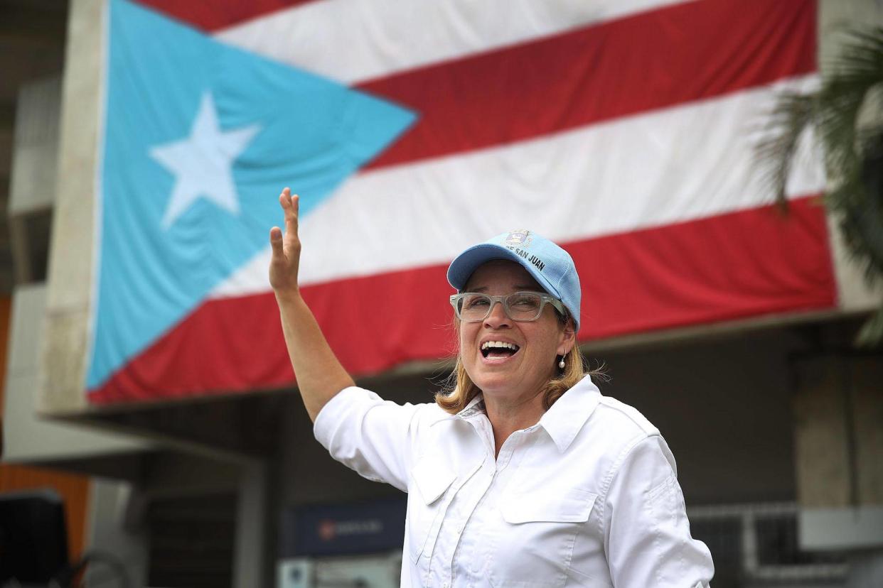 San Juan Mayor Carmen Yulin Cruz speaks to the media as she arrives at the temporary government center setup at the Roberto Clemente stadium in the aftermath of Hurricane Maria: Getty Images