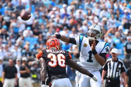 Sep 23, 2018; Charlotte, NC, USA; Carolina Panthers quarterback Cam Newton (1) passes for a touchdown as Cincinnati Bengals defensive back Shawn Williams (36) defends in the second quarter at Bank of America Stadium. Mandatory Credit: Bob Donnan-USA TODAY Sports