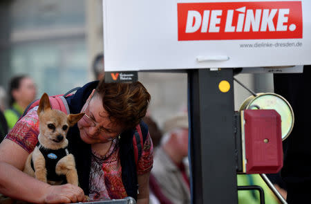 Visitors hear a speech of Gregor Gysi of the Left Party Die Linke during a rally for the upcoming European Parliament elections in Dresden, Germany, April 24, 2019. Picture taken April 24, 2019. REUTERS/Matthias Rietschel