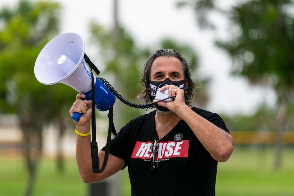 Manuel Oliver, whose son, Joaquin, was shot and killed along with 16 others at Marjory Stoneman Douglas High School, speaks during a Black Lives Matter rally at Pine Trails Park in Parkland on July 11, 2020.