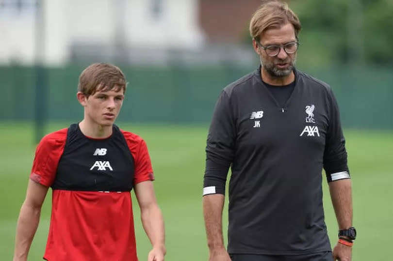 Leighton Clarkson and Jurgen Klopp speak during Liverpool training