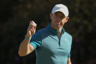 Rory McIlroy, of Northern Ireland, holds up his ball after making an eagle putt on the 13th hole during the final round at the Masters golf tournament on Sunday, April 10, 2022, in Augusta, Ga. (AP Photo/Charlie Riedel)