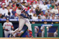 Atlanta Braves' Travis d'Arnaud hits a run-scoring single against Philadelphia Phillies pitcher Zack Wheeler during the third inning of a baseball game, Tuesday, June 28, 2022, in Philadelphia. (AP Photo/Matt Slocum)