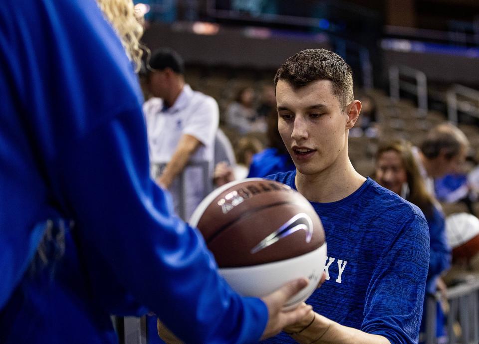 Kentucky's Zvonimir Ivišić, the 7-foot-2 freshman center from Croatia, signed autographs before the Blue-White scrimmage tipped off at Northern Kentucky University on Saturday.