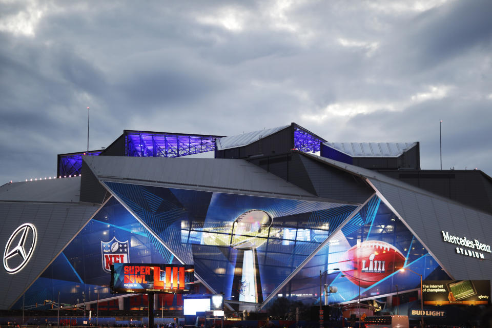 Mercedes-Benz Stadium is lit up ahead of Sunday's NFL Super Bowl 53 football game between the Los Angeles Rams and New England Patriots in Atlanta, Saturday, Feb. 2, 2019. (AP Photo/David Goldman)