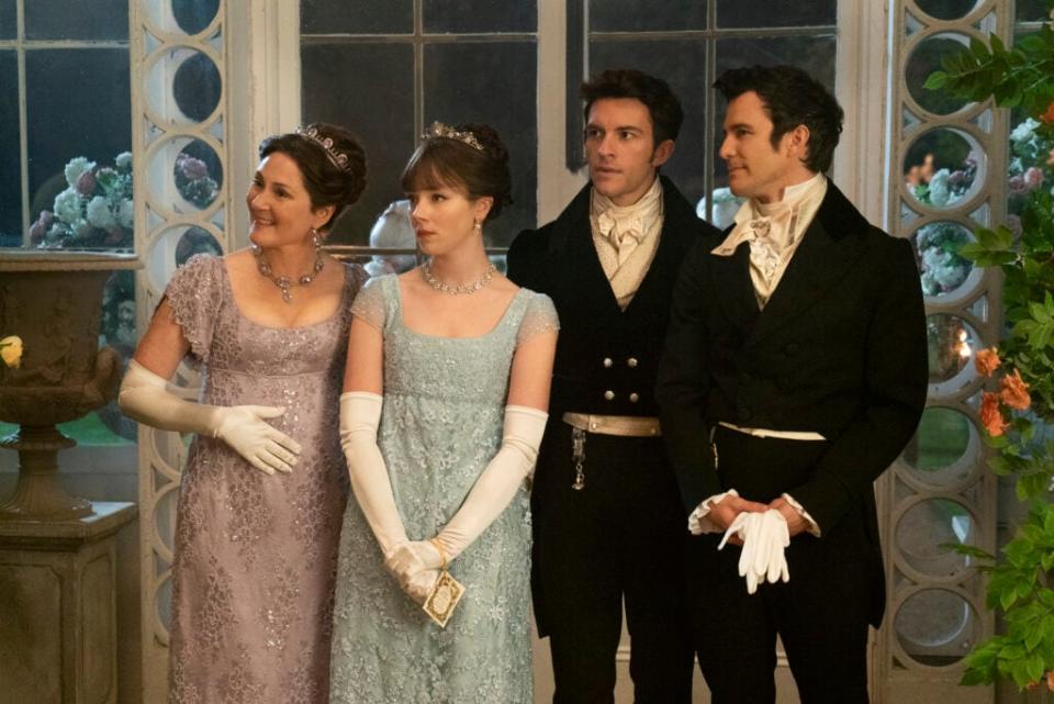 Ruth Gemmell as Lady Violet Bridgerton, Claudia Jessie as Eloise Bridgerton, Jonathan Bailey as Anthony Bridgerton, and Luke Thomspon as Benedict Bridgerton (Cr. Liam Daniel/Netflix © 2021)