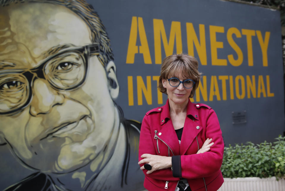 Amnesty International Secretary General Agnes Callamard poses in Paris, Tuesday, April 6, 2021. Agnes Callamard is best known for her investigation into the killing of Saudi journalist Jamal Khashoggi, and has made a career uncovering extra-judicial killings. The French human rights expert's focus on rights abuses is taking on new dimensions as she assumes leadership of Amnesty International and turns her attention to what she says is one of the world's most pressing rights issues — vaccine equity. (AP Photo/Christophe Ena)