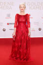 This shimmering blood red Jacques Azagury gown offset the star’s silvery locks beautifully. <i>[Photo: Rex]</i>