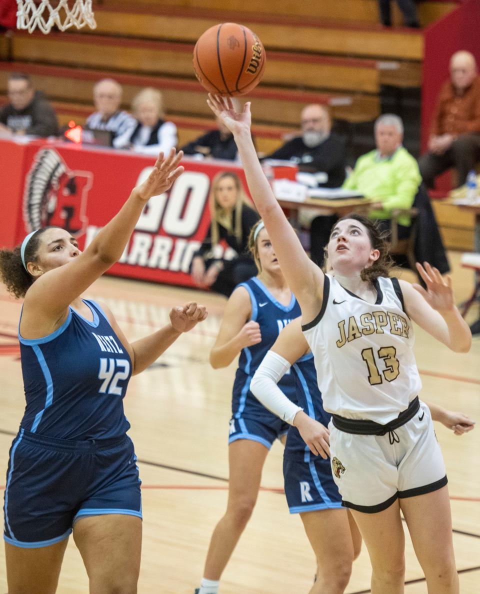 Jasper’s Carlee Rogers (13) takes a shot as the Reitz Panthers play the Jasper Wildcats during the semifinal round of the 2023 IHSAA Class 4A Girls Basketball Sectional at Harrison High School in Evansville, Ind., Friday, Feb. 3, 2023.